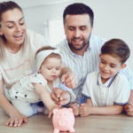 Young family teaching children about saving with a piggy bank, symbolising the importance of creating a cash flow budget in Croydon